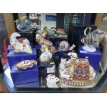 Fourteen Royal Crown Derby paperweights, including a blue jay, mallard, badger, camel, snail, walrus