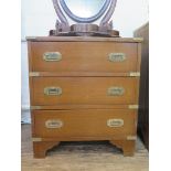 A reproduction brass bound mahogany campaign style chest, the leather inset top over three drawers