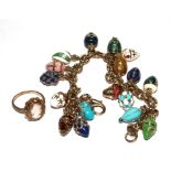 A costume jewellery charm bracelet including seventeen eggs, and a 9 carat gold cameo ring