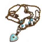 A costume jewellery necklace with a blue enamel heart pendant