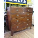 An early 19th century mahogany and line inlaid chest of drawers, with two short and three long