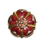 A 9 carat gold and red enamel brooch in the form of a rose