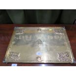 An Arts & Crafts brass rectangular tray, with monogram to the centre and grape motifs to the