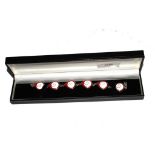 A 925 silver bracelet with six coloured enamel red and white roundels, boxed