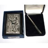 A small leather bound diary with silver Sheffield 1998 cover and 925 cased pen