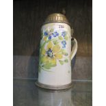 An early 19th century German faience stoneware stein, depicting yellow and blue flowers, the