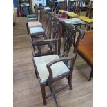 A harlequin set of eight George III style mahogany dining chairs, with interlaced splats, drop-in