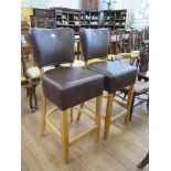 A pair of bar stools with upholstered backs and seats (2)