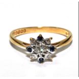 An 18 carat yellow gold ring set with diamonds and sapphire