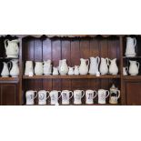 Various Victorian and later relief moulded jugs, all in white, including Charles Meigh Bacchus