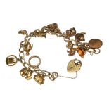 A 9 carat gold charm bracelet with charms, total weight 29g
