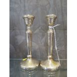 A pair of silver candlesticks, of turned tapering form, Birmingham 1976, 15 cm high