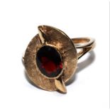 A 9 carat gold ring set with garnet