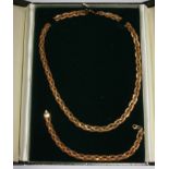 A 9 carat gold woven necklace and matching bracelet