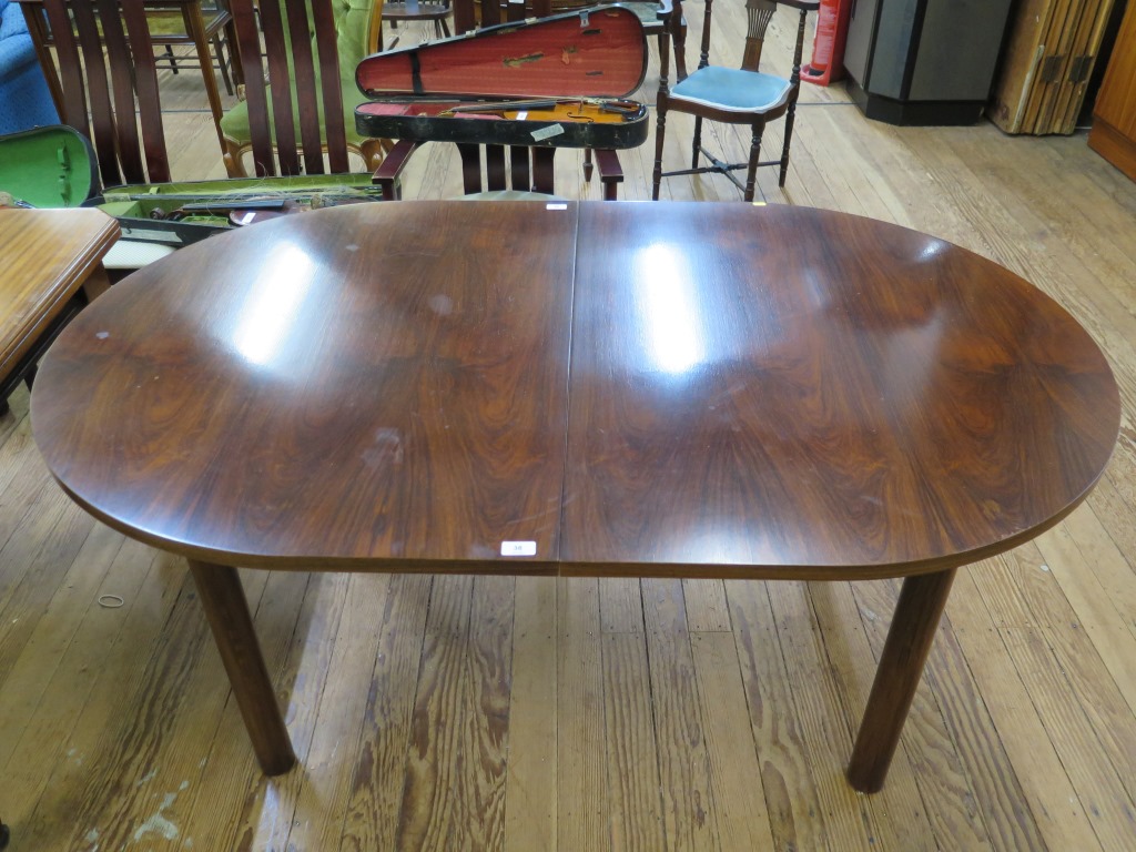 A Danish Skovby rosewood dining room suite, comprising a display cabinet, the twin sliding glazed