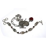 A gentleman's silver Albert with spinning seal and a gem set silver bracelet