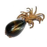 A continental brooch, set with cats eye in the form of a pine apple by Sterle Paris with French