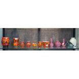 Seven Poole Pottery Delphis vases, highest 16 cm, Four Poole Pottery lustre glaze vases and a figure