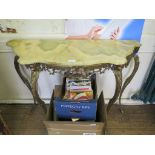 An Italian gilt metal and green marble console table, with pierced frieze, and mask head cabriole