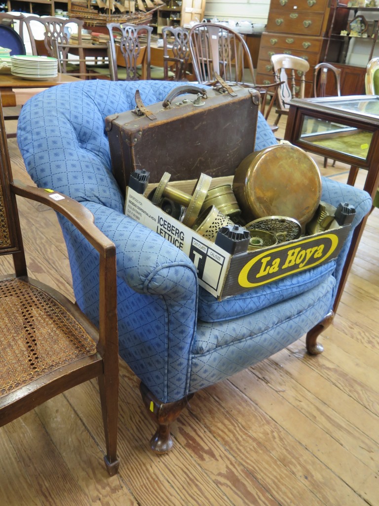 A 1920s blue button back upholstered arm chair with cabriole legs and pad feet