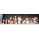 A collection of Victorian Staffordshire pottery figures, including a watch stand 19.5 cm high,