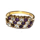 An 18 carat gold ring set with diamonds and amethysts, as found