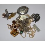 A small collection of mixed jewellery to include garnet brooch, silver locket, etc