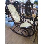 A Thonet style bentwood rocking chair, with canework back and seat