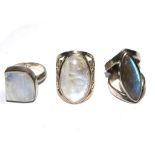 A small collection of three gem set silver rings