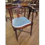 An Edwardian inlaid mahogany corner chair, the patera and foliate inlaid top rail over ring turned