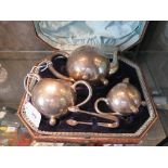 A Victorian silver three piece tea set of bullet form by Hilliard & Thomson, Birmingham 1889, in