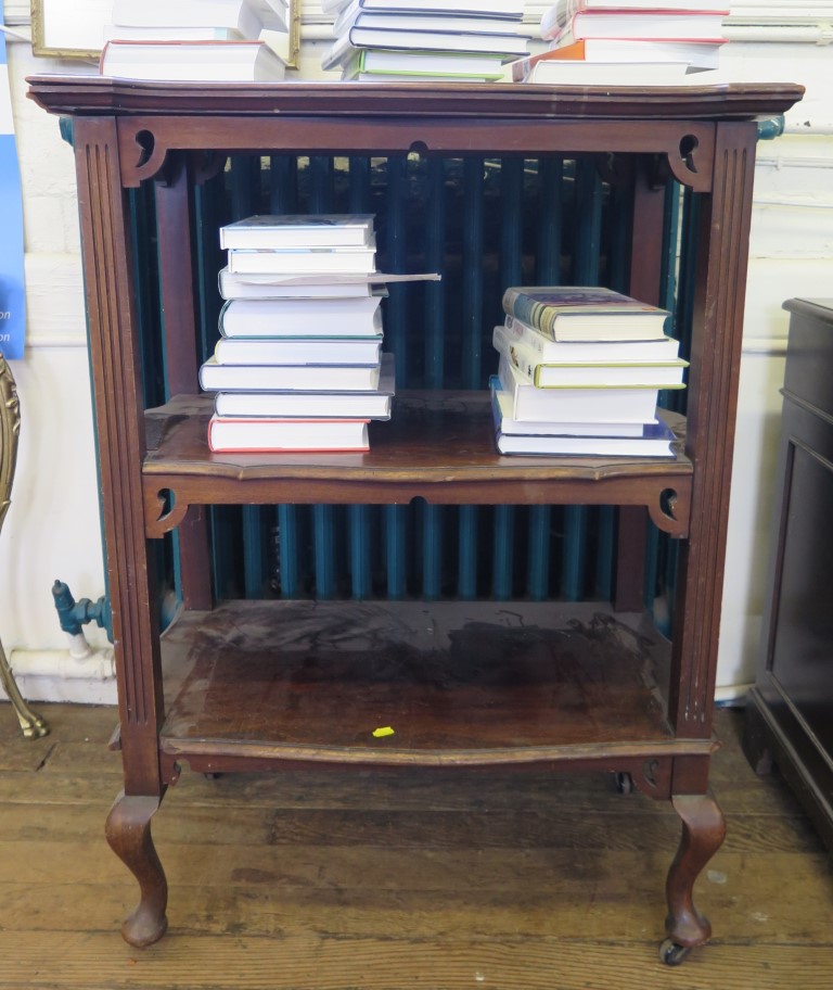 An Edwardian walnut three tier whatnot, with shaped rectangular shelves on cabriole legs and