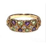 A 9 carat gold ring with heart shaped amethyst and peridot, together with three diamonds to the