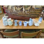 Seven late Victorian jugs, including relief moulded jugs in blue and white, a moulded tea pot and