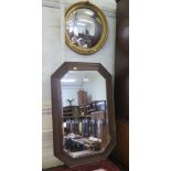A giltwood convex wall mirror, 44 cm diameter, an oak framed bevelled plate wall mirror, and an oval