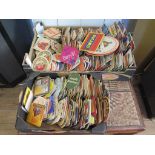 A collection of various beer mats, including German and Dutch, two trays