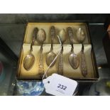 A boxed set of silver colour metal coffee spoons