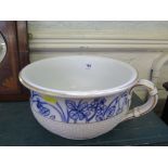A pottery chamber pot with gilt and lattice decoration and blue painted border, with impressed