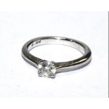 An 18 carat white gold ring with single stone diamond 0.28 carat, clarity SI1, colour G, with