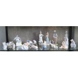 A collection of Lladro and Nao figures of children, polar bears, kittens and geese, largest 25 cm