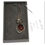 A silver cat pendant set with cabochon millefiori glass, with fine chain, in box