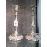 A pair of Viners of Sheffield silver plated candlesticks