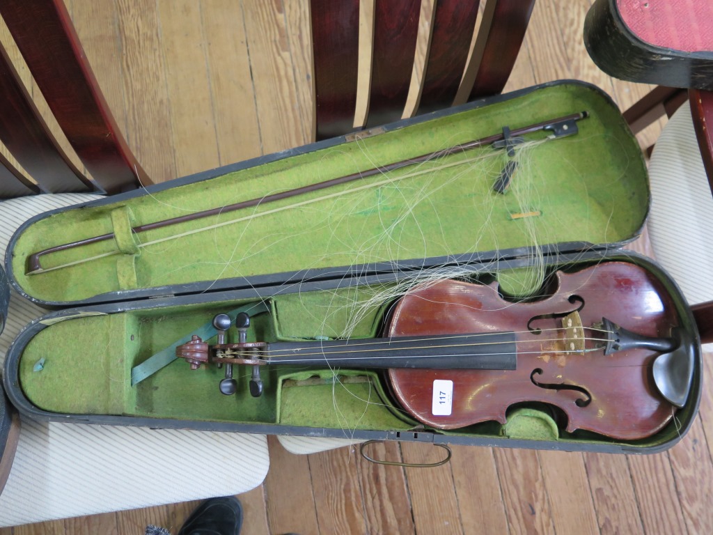 A violin, labelled Carlo Storioni Cremonensis faciebat 1780, with two piece back 59 cm long,