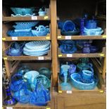 A large collection of Victorian and later blue pressed glass wares, including baskets, plates,