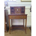 An Edwardian inlaid mahogany lady's secretaire, the top with urn inlaid fall enclosing