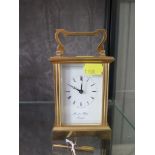 A brass carriage clock timepiece, of conventional form, the dial inscribed Morrell & Hilton, 15 cm