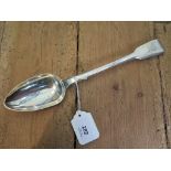 A George IV silver fiddle pattern basting spoon, engraved with a crest, maker's mark SB/IB, London