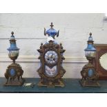 A 19th century French porcelain and gilt metal mounted clock garniture set, the panels depicting