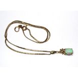 An opal pendant, set with 9 carat gold neck chain