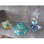 Three pieces of Mdina glass, signed to base - seahorse paperweight, pair of bird paperweights and